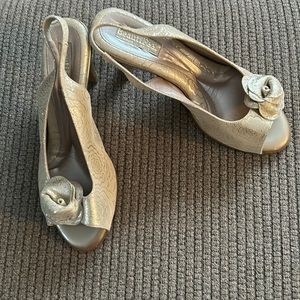 Gold flower pattern sling back. Heavily cushioned. New with box and dust bag.